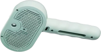 PetShiply Steam Grooming Brush in use